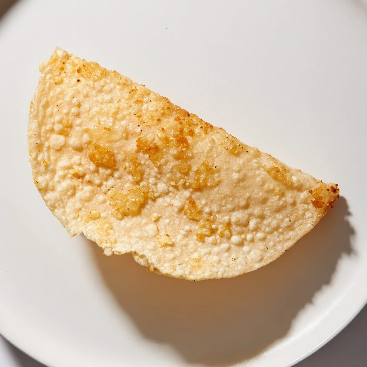 Imagine a stack of homemade crispy shells, lightly glistening with oil, awaiting your favorite toppings.