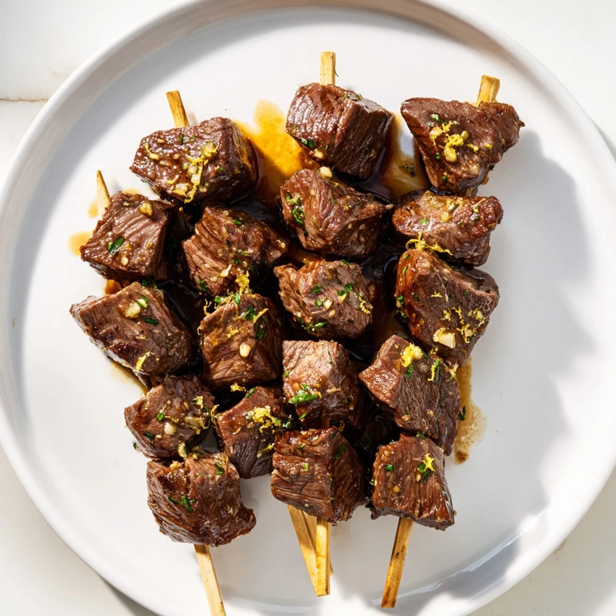 Juicy Garlic Butter Steak Skewers, seared and sizzling, ready to be brushed with fragrant garlic butter.