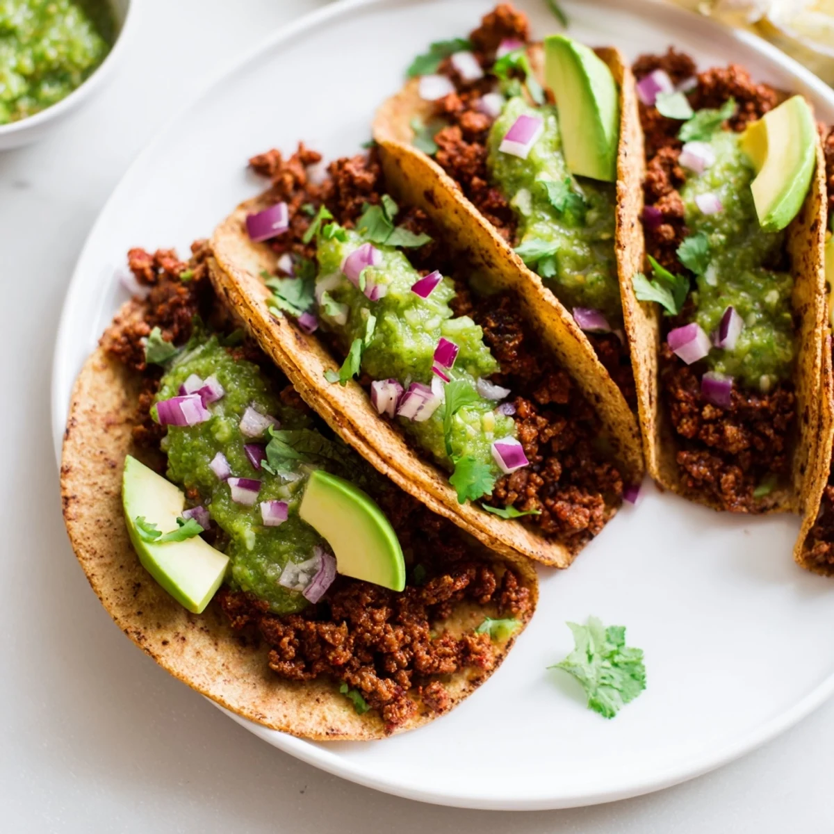 Fresh, vibrant beef tacos with salsa verde: a tempting Mexican dish featuring zesty tomatillo sauce.
