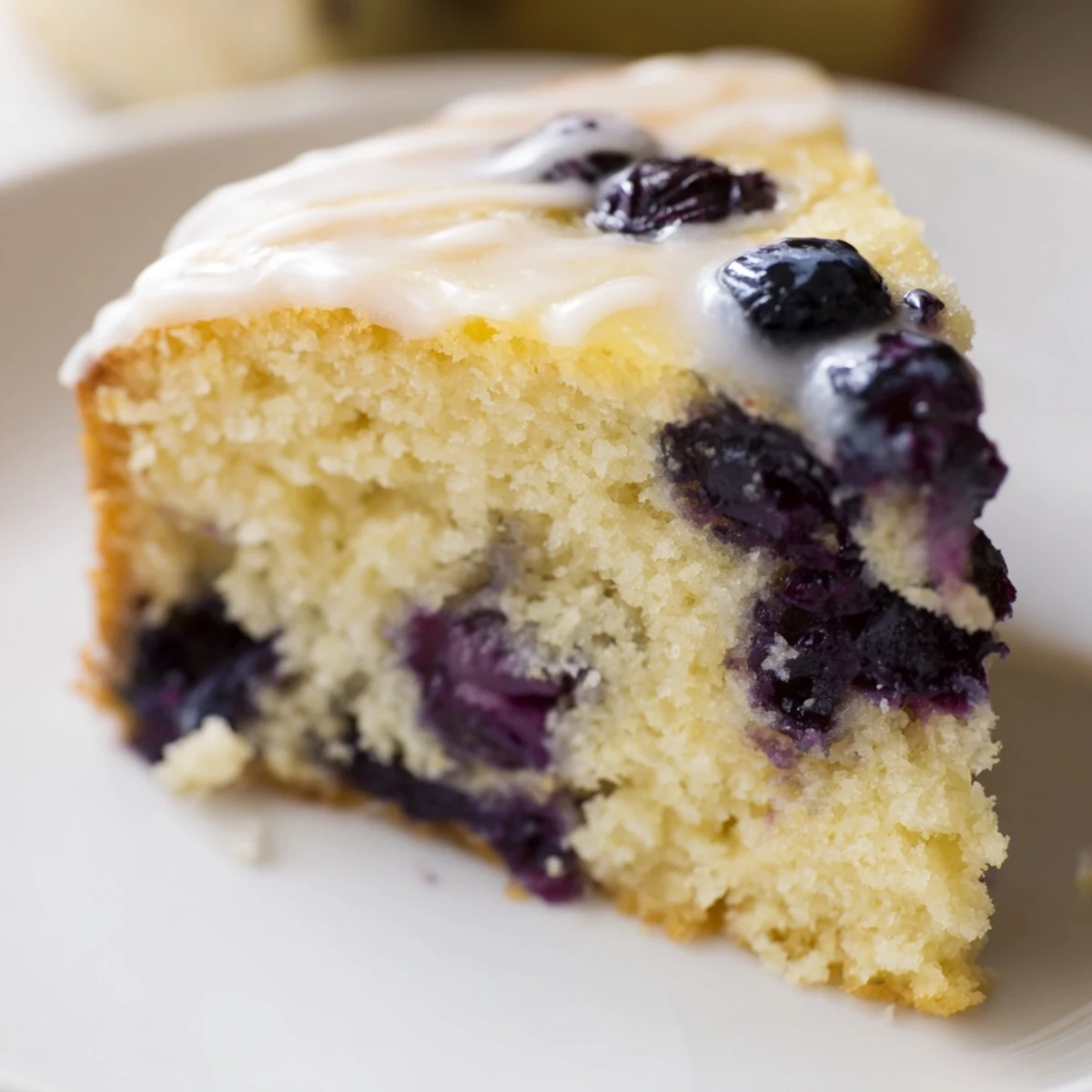 Freshly baked Lemon Blueberry Cake with a light, fluffy texture, perfect for dessert.