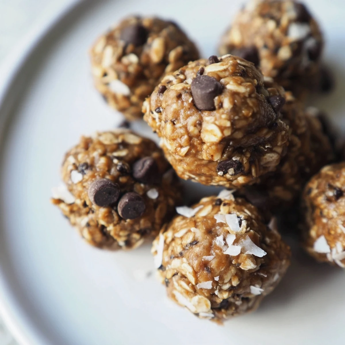 Perfectly chilled Chocolate Peanut Butter Energy Balls rest on a baking sheet, ready for quick snacking or meal prep.