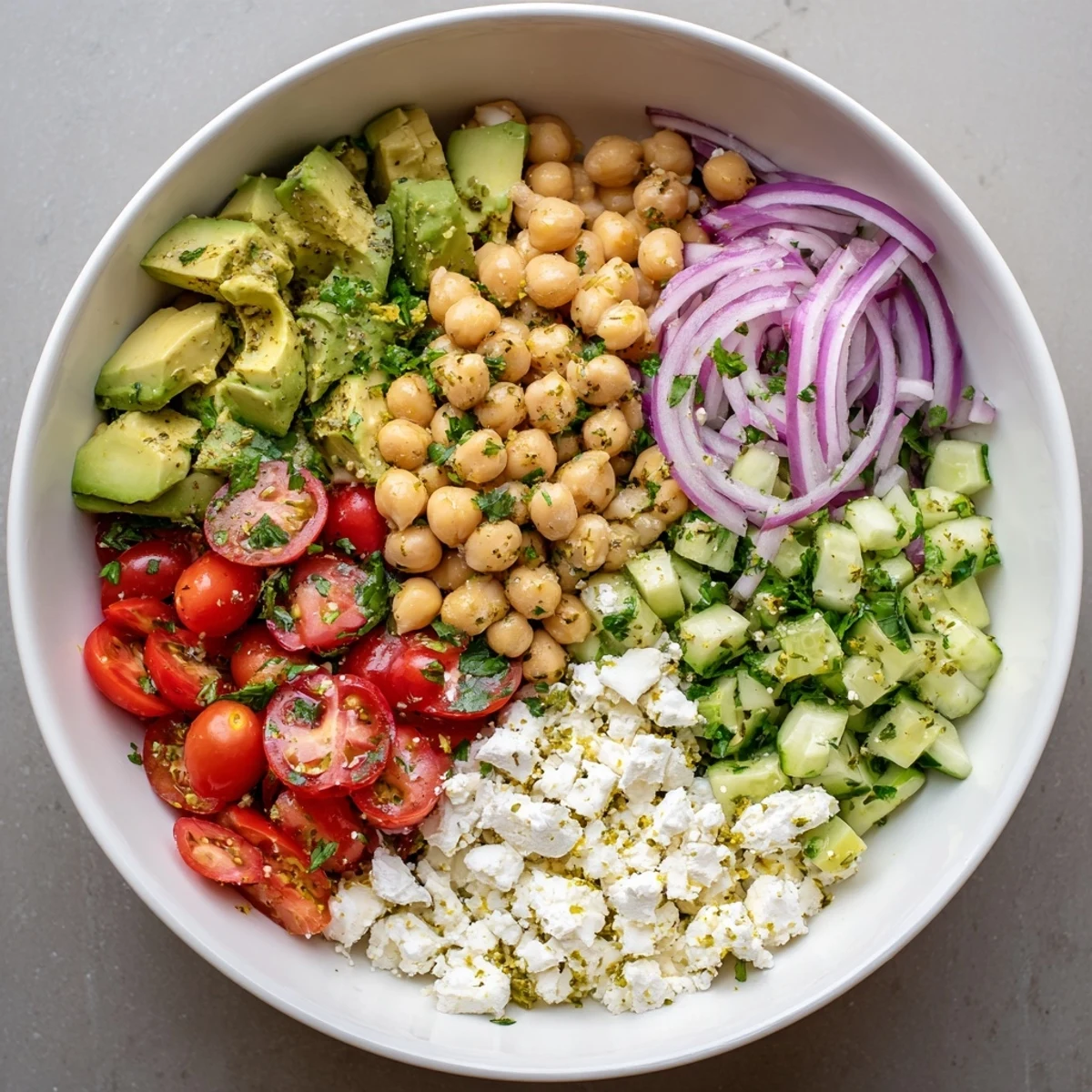 Creamy avocado and crumbled feta mingle with hearty chickpeas in this vibrant Chickpea Feta Avocado Salad.