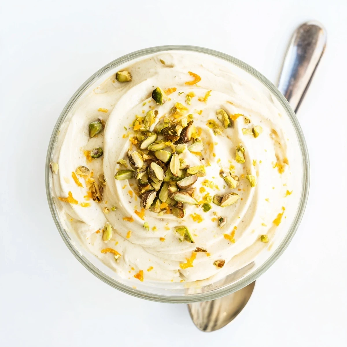 Airy Lebanese Date Orange Blossom Mousse garnished with pistachios and orange zest, perfect after dinner.