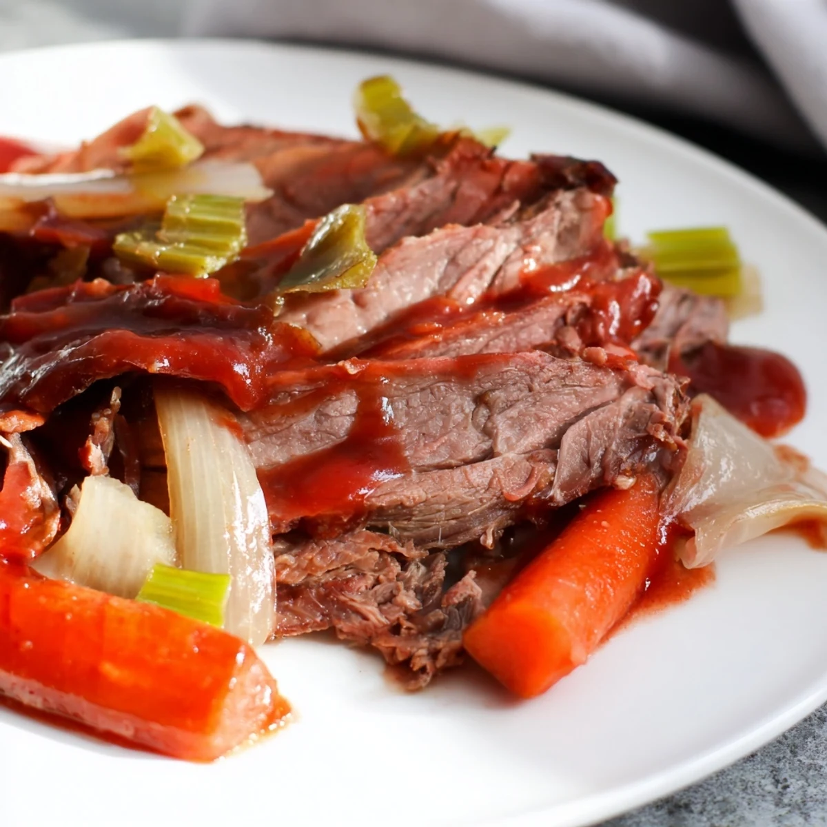 Juicy slow cooker beef brisket slices arranged on a rustic wooden board with vegetable medley and thick sauce