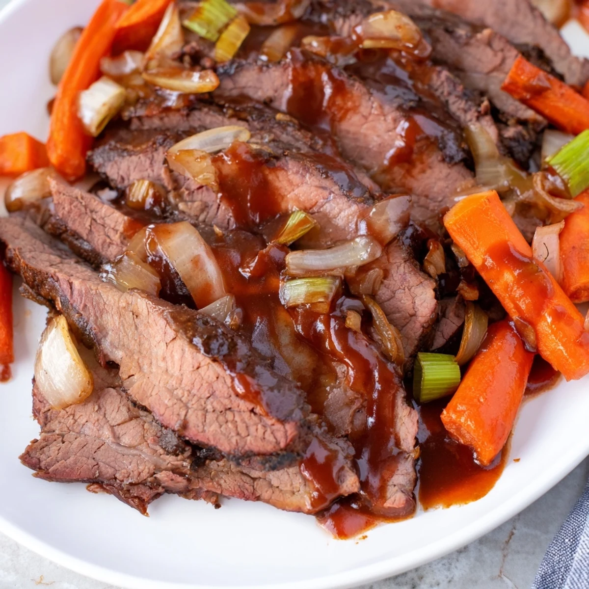 Fork-tender slow cooker beef brisket served on a white platter with roasted vegetables and glossy dark gravy