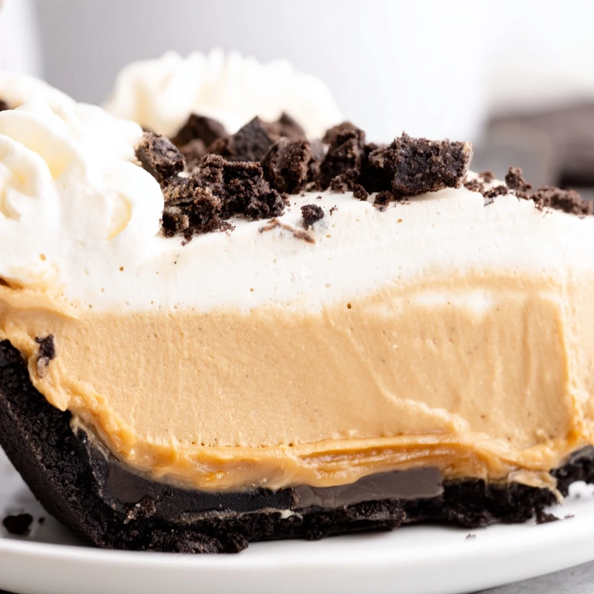 A rich peanut butter Oreo pie with a chocolatey crust fresh from the refrigerator