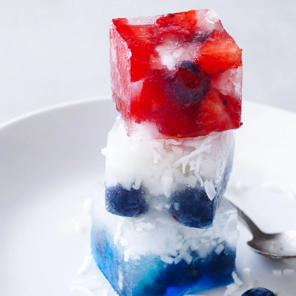 Red White And Blue Ice Cubes Recipe in tray, bright berries and creamy coconut.