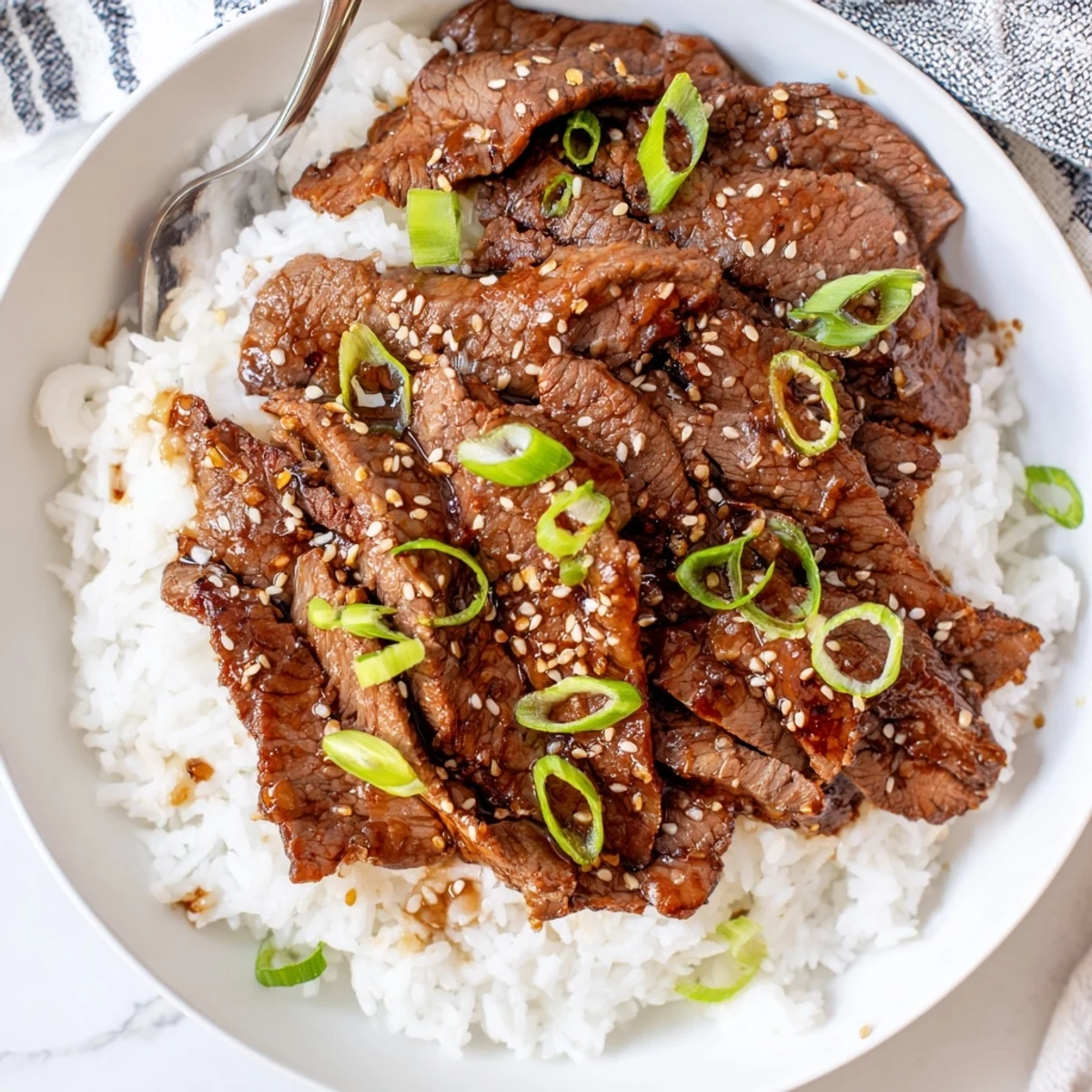 Warm Korean Beef tossed with scallions and sesame, fragrant, savory sweet.