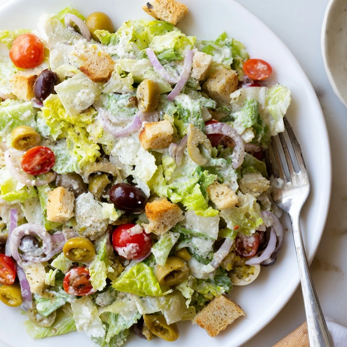 Vibrant Olive Garden Salad featuring pepperoncini, red onions, and tangy signature dressing